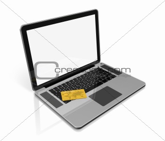 gold credit card on laptop