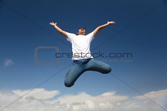 Happy man jumping with  blue sky background