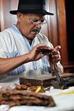 man making luxury handmade cuban cigar