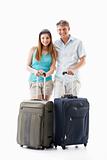 Young couple with suitcases
