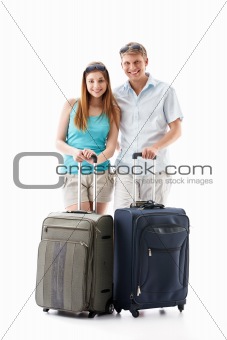Young couple with suitcases