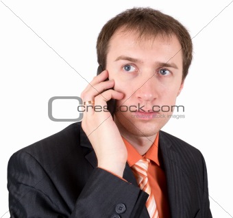 The businessman speaks by a mobile phone