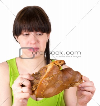 The young woman looks at  meat