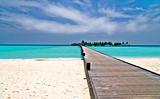 footbridge over turquoise ocean on an maldivian island