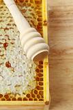 wooden box with natural honeycombs and honey