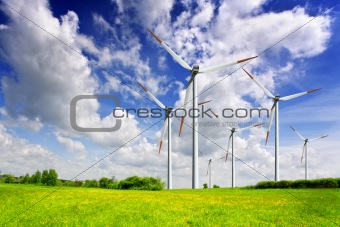 Wind turbines on spring field