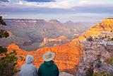 Couple Enjoying the Beautiful Landscape of the Grand Canyon Sunset.