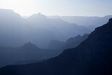 Scenic Layers of the Grand Canyon in the Early Morning with Hikers Cabin Roof Shining in the Lower Middle.