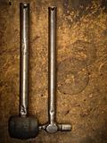 Old iron hammer and rubber hammer hanging