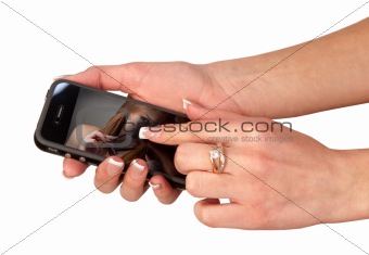 hands of the girl who holds a mobile phone