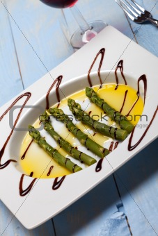 green asparagus on a white plate