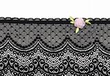 Black lace with rose satin flower on white background