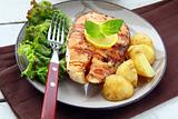 red fish salmon grilled with lemon and salad