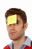 man with post it on his forehead