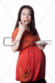 Adult pregnant woman eats cottage cheese.