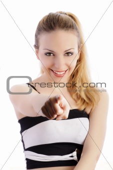 Pretty girl with pony tail pointing at camera