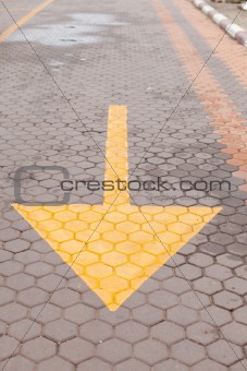 yellow arrow on the ground