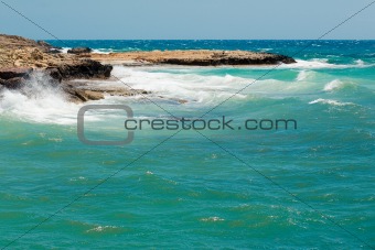 Waves in the sea near rocky coast