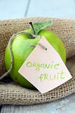 fresh organic green apple on the natural background