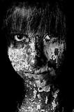 Dark art portrait of a girl with cracks and old paint 