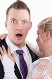 Surprised groom with wife