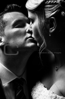 Beautiful couple kissing in black and white
