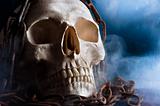 human skull with chain and smoke