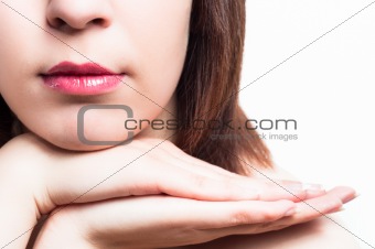 Lips of a girl with her hands