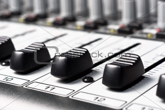 Part of an audio sound mixer with buttons