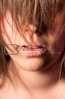 Closeup of a girl with sugar on her lips