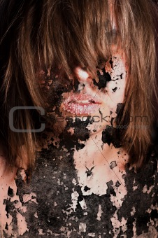 Dark art portrait of a girl with cracks and old paint