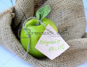 fresh organic green apple on the natural background