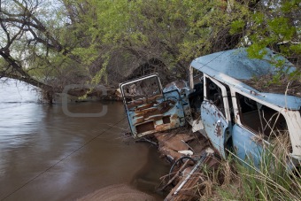 junk cars on river
