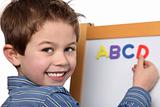 young boy learing the ABC