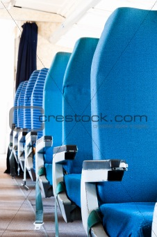 Blue seats of an Airplane with blurry background
