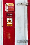 Closed Door of a nuclear facility with signs on it