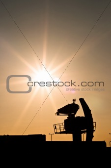 Silhouette of an old radar against sunset