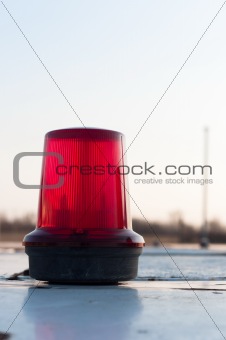A red siren on a top of a car