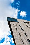 Modern building angle shot against blue sky
