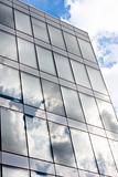 Modern office building with reflection of the sky