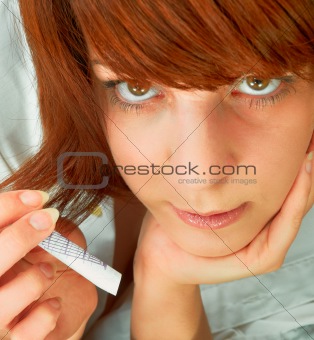 Young attractive woman showing rolled up money