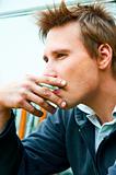 Closeup of a young man with cigarette in mouth