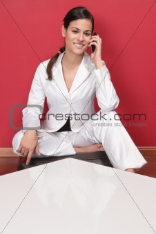 Pretty young executive using cell phone