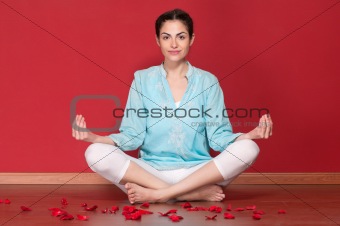 Young beautiful female practicing yoga