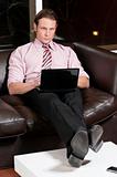 Smart businessman working on laptop