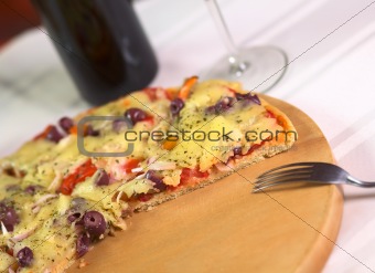 Pizza on Wooden Plate
