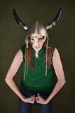 Woman in Viking Helmet Flexes Her Muscles