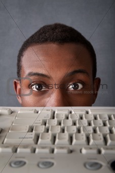 Eyes of Man Above Keyboard