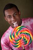 Man Licks Giant Candy Sucker