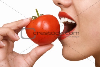 Young Woman Eating Tomatoes